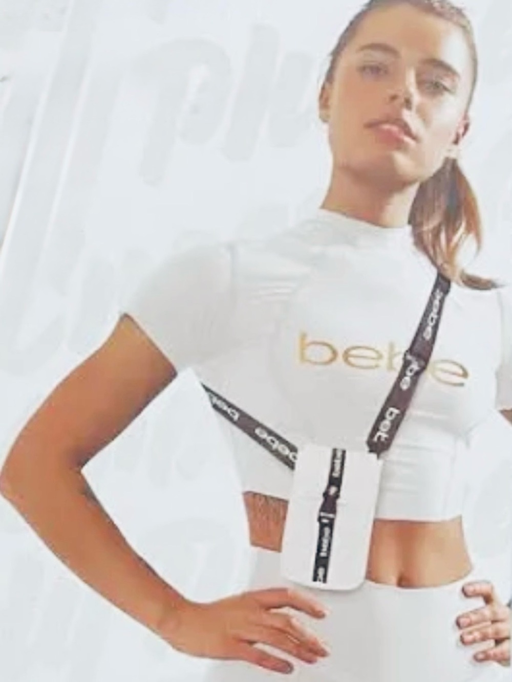 The Elite bebe White Crossbody Phone Pouch with Black Logo Strap